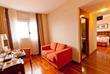 Doppelzimmer und Sitzbereich